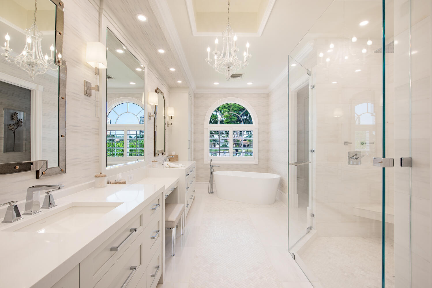 Marble vanity with brass fixtures and glazed tile